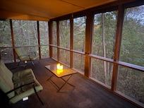 The enclosed porch. We brought battery operated candles for ambience.