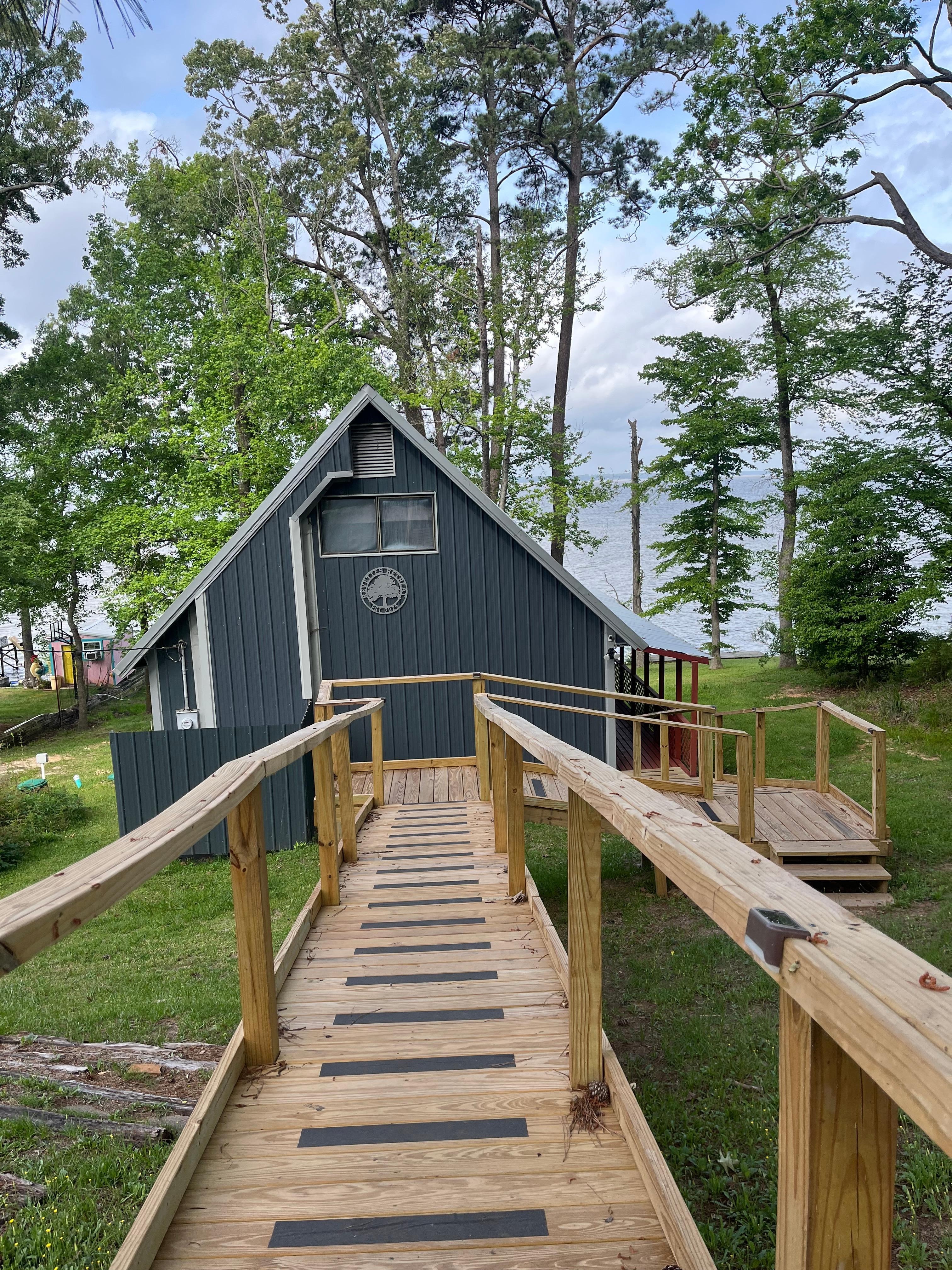 Nice walkway with nonslip strips from driveway going down to the cabin 