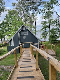 Nice walkway with nonslip strips from driveway going down to the cabin