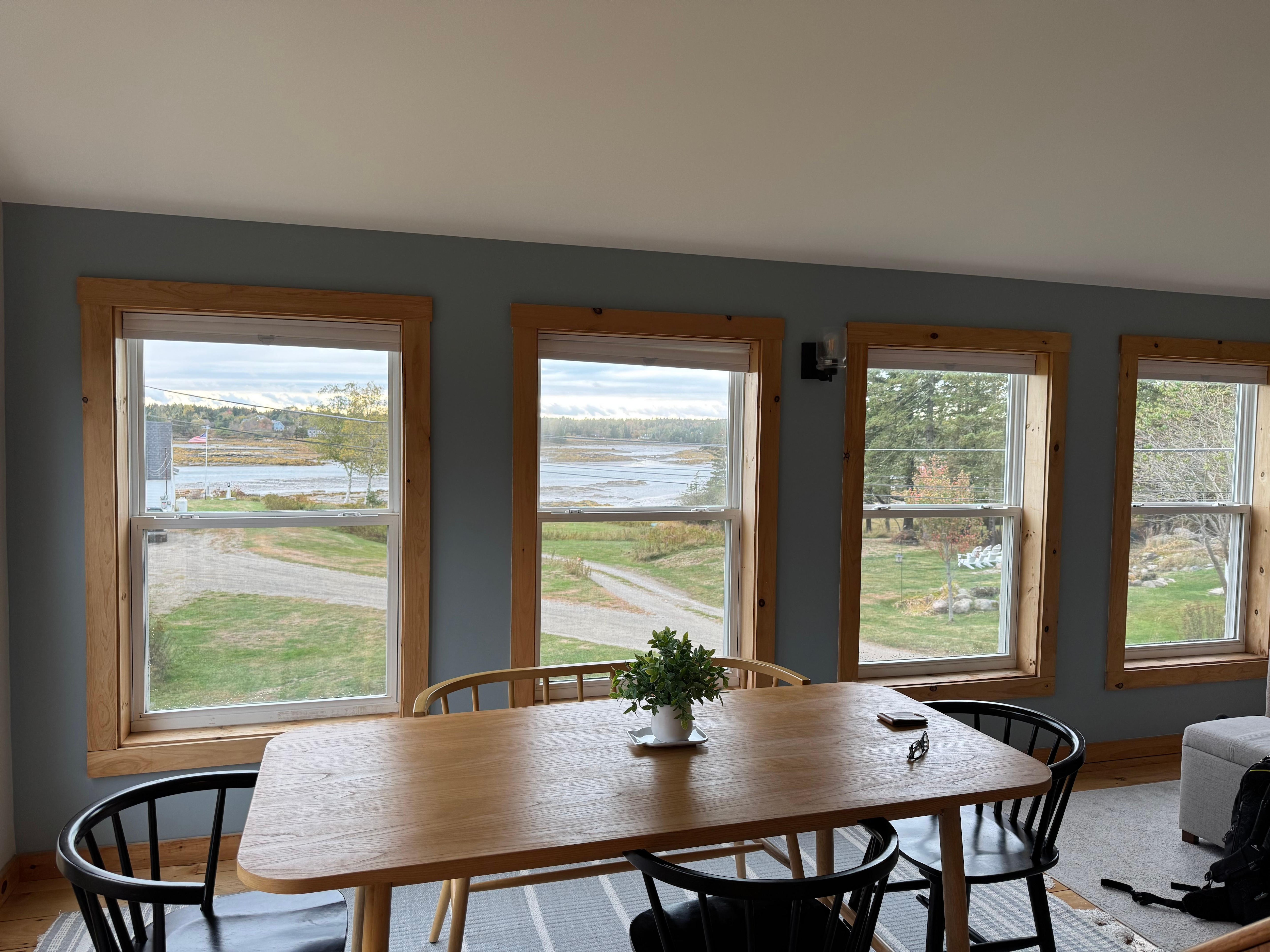 Warm, bright eating area with a view of the harbor.