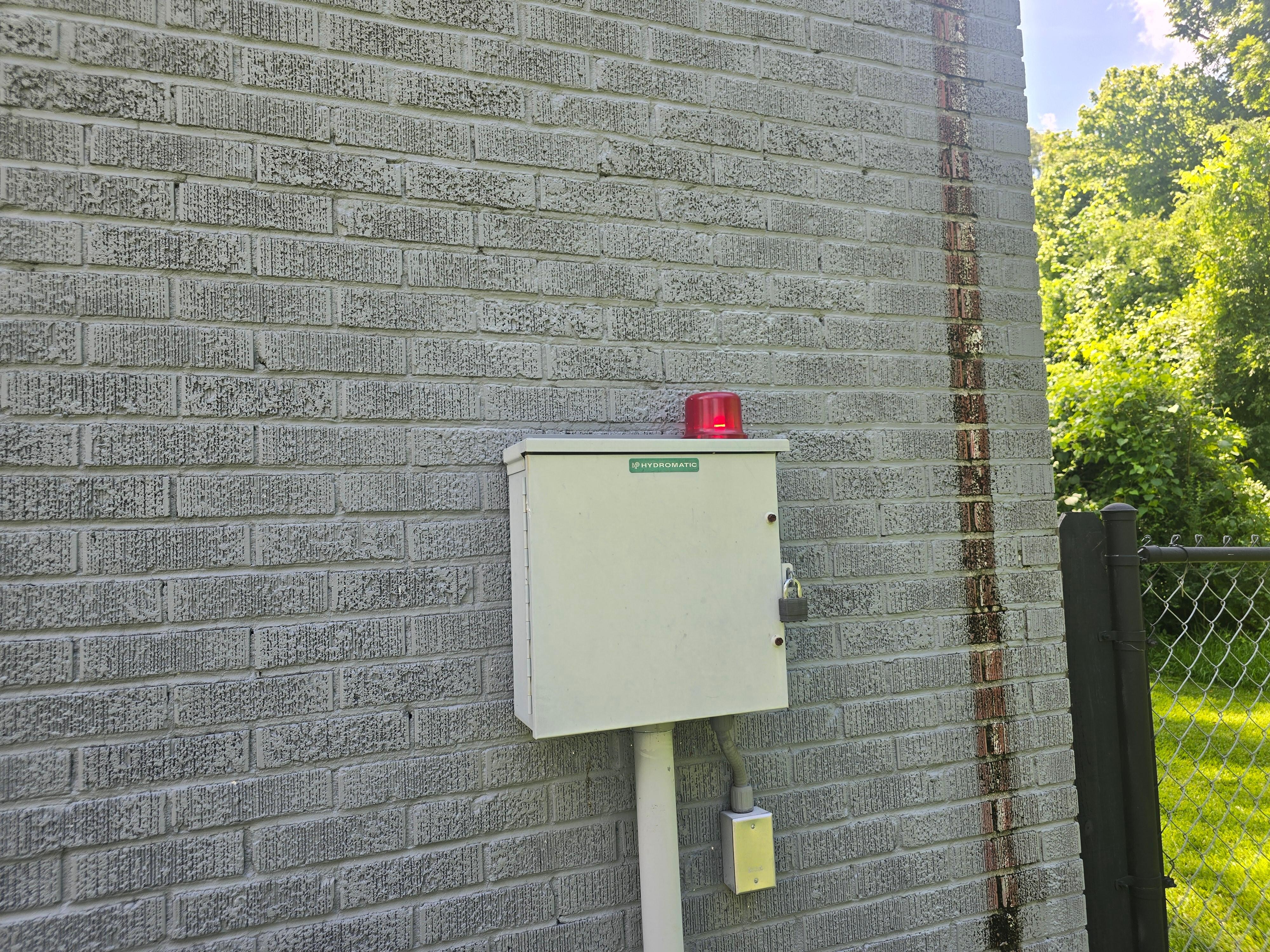 Flashing light on the outside requiring a  visit by Vicksburg Sewer Company
