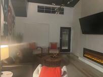This picture does not do the space justice. The kitchen and living room are airy, bright, and the mural on the left is fantastic! I loved the electric fireplace under the TV. Perfect place to hang out and wind down after a busy day.