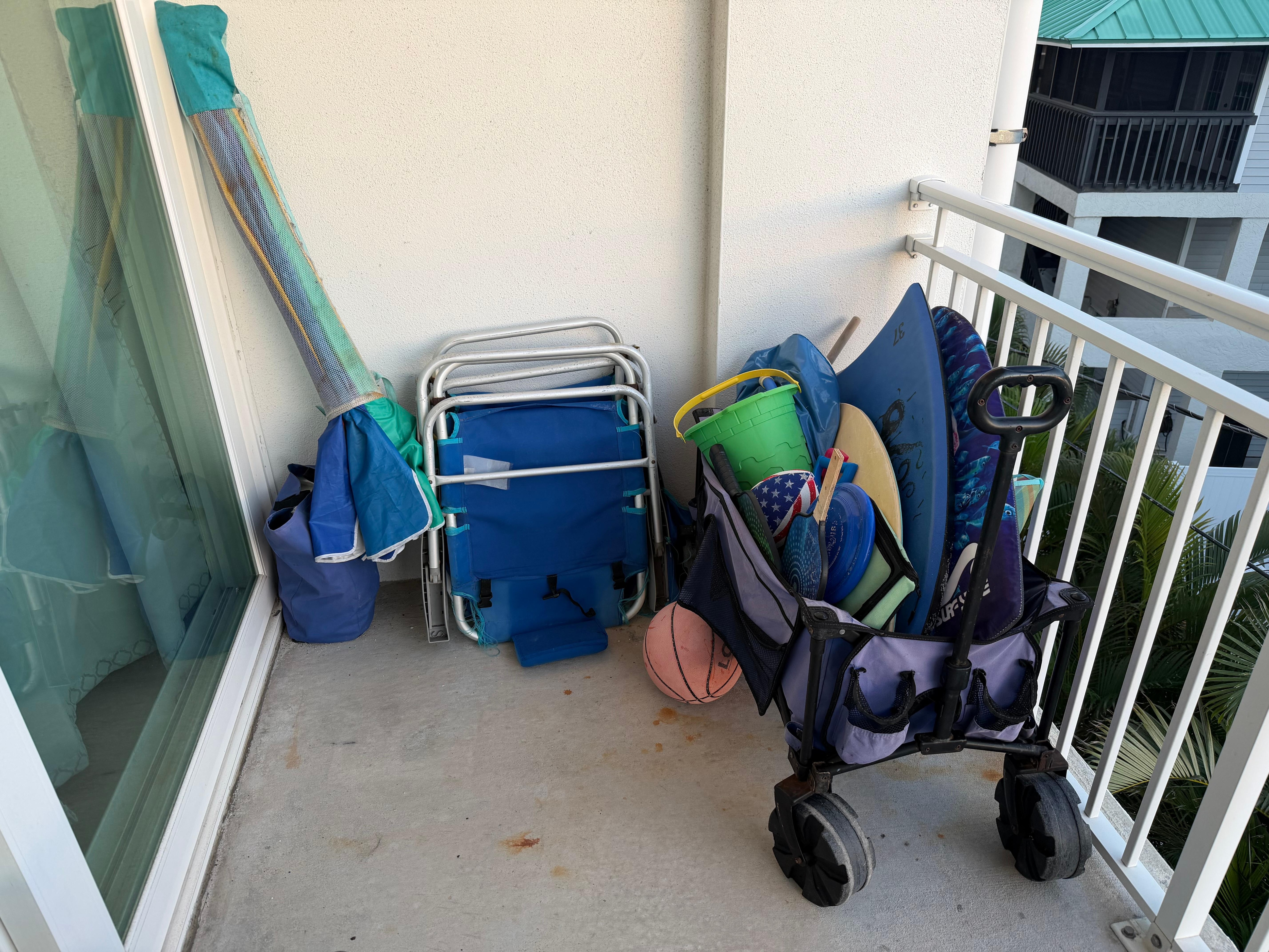 Sand toys, wagon and chair to use.