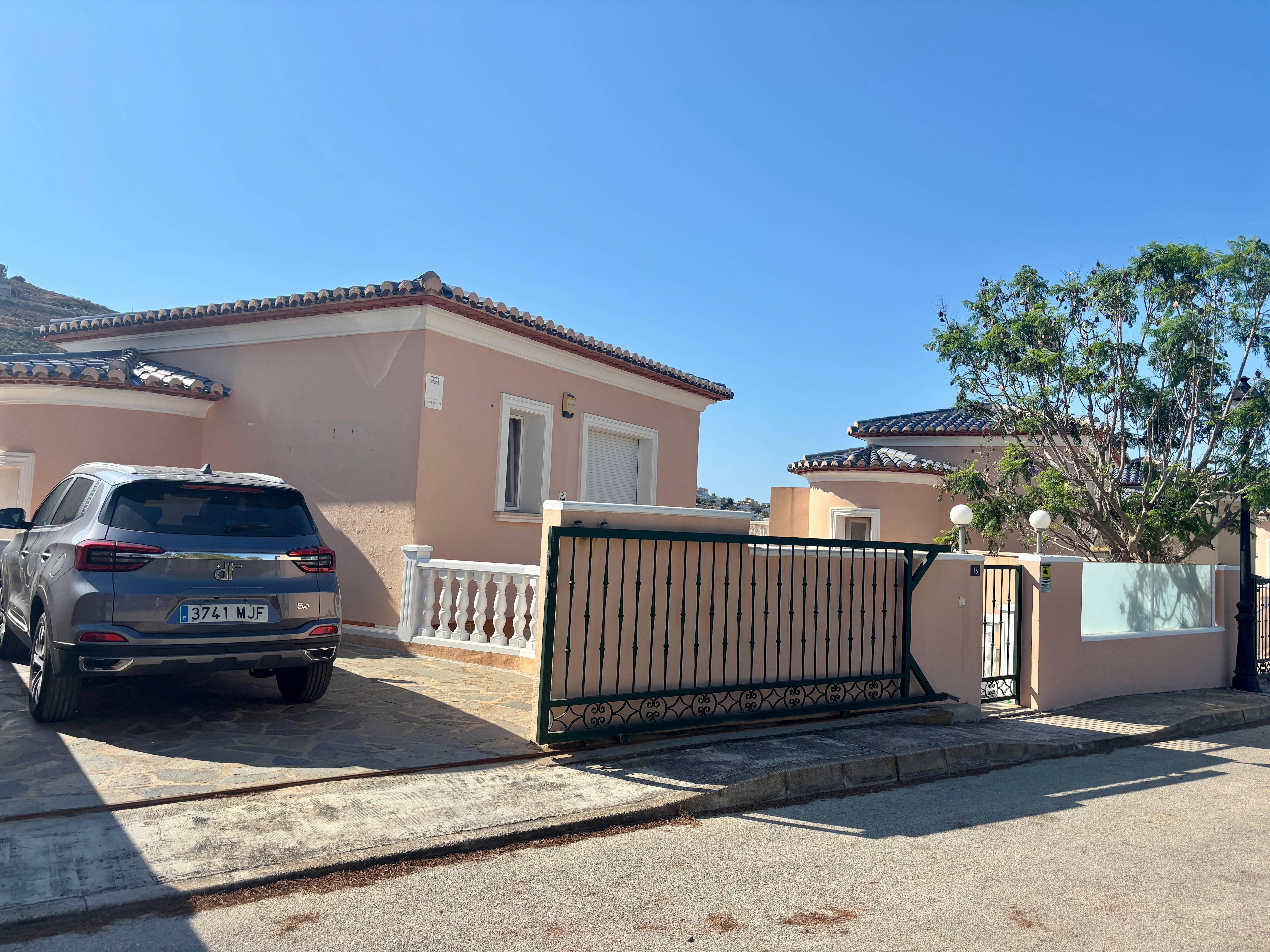 Front of Villa with car parking. 