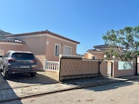 Front of Villa with car parking.