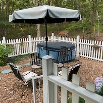 Table and chairs. Hot tub not available at the time.