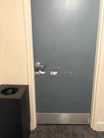 Door to our floor, example of the type of repairs needed to communal areas