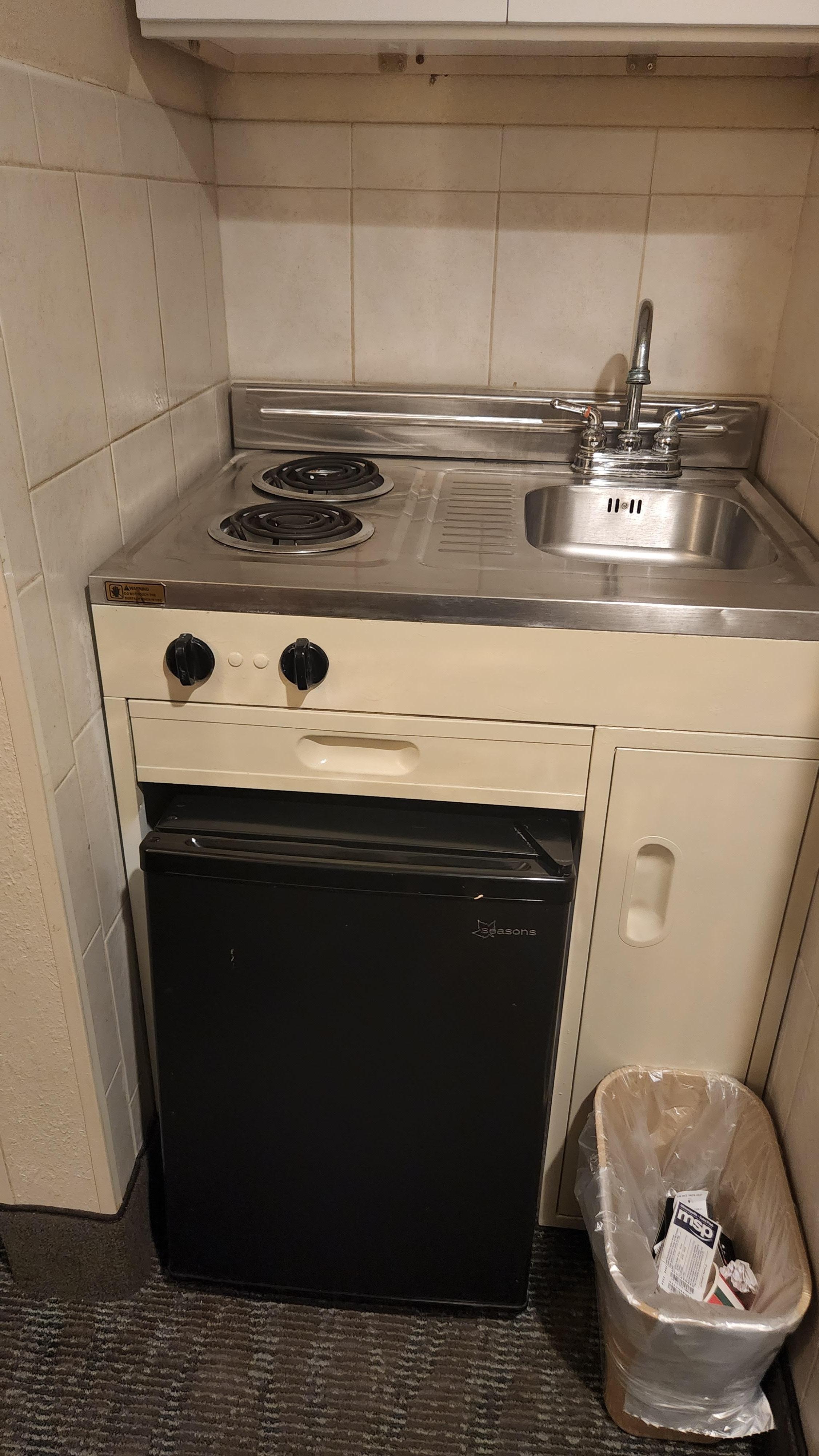 This is the kitchenette. The fridge is at an angle