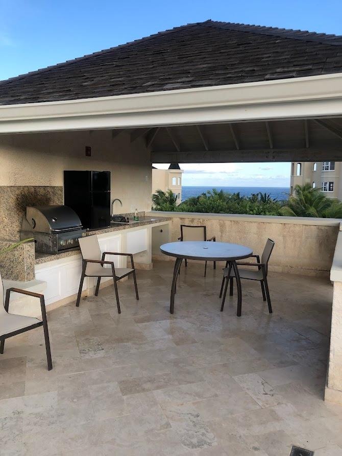 Private rooftop BBQ grill and seating area