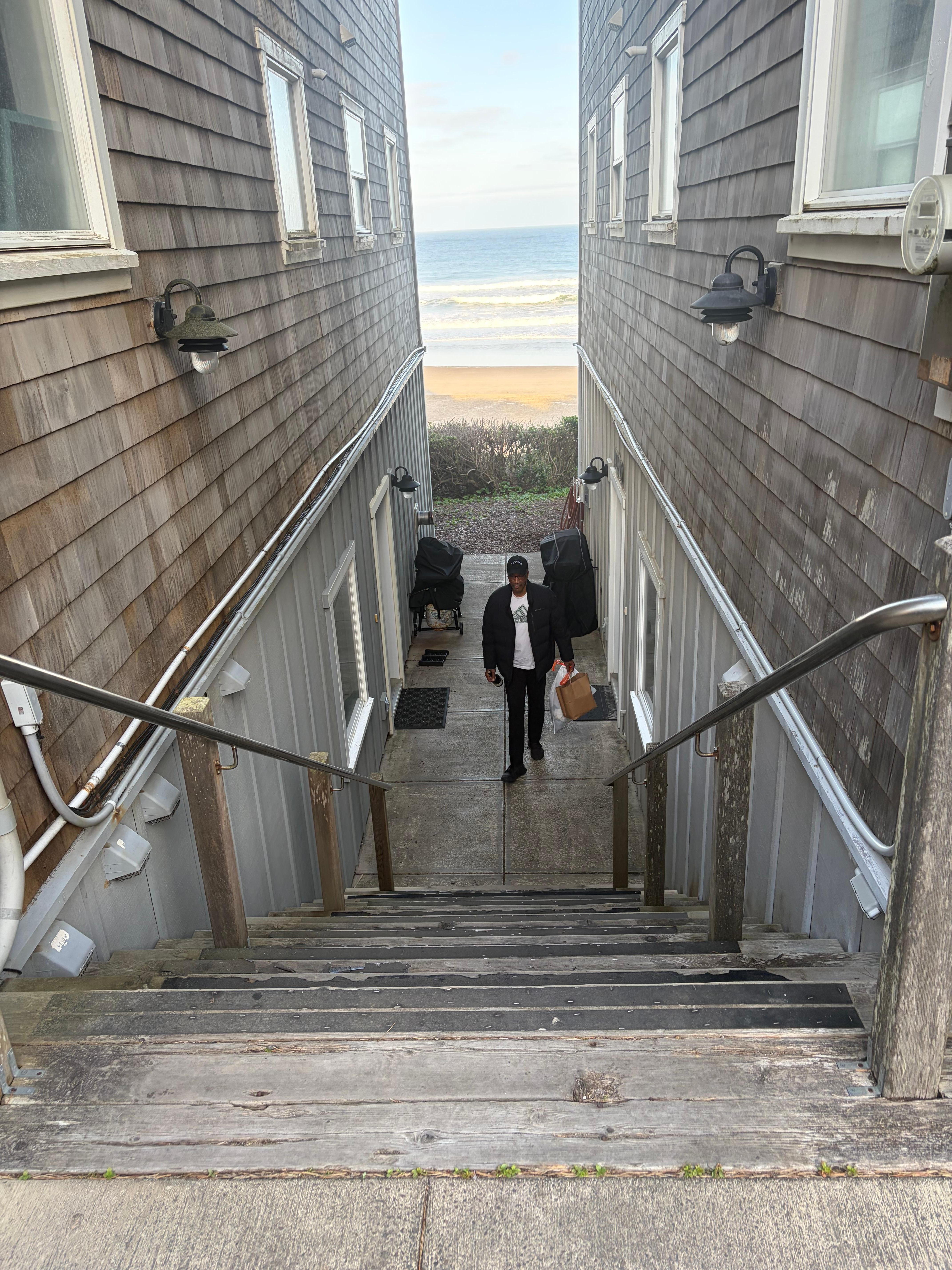A flight of stairs down to the front door. 