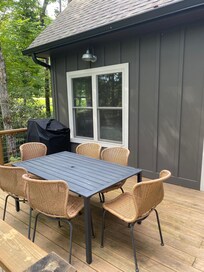 Dining table and grill on the back deck