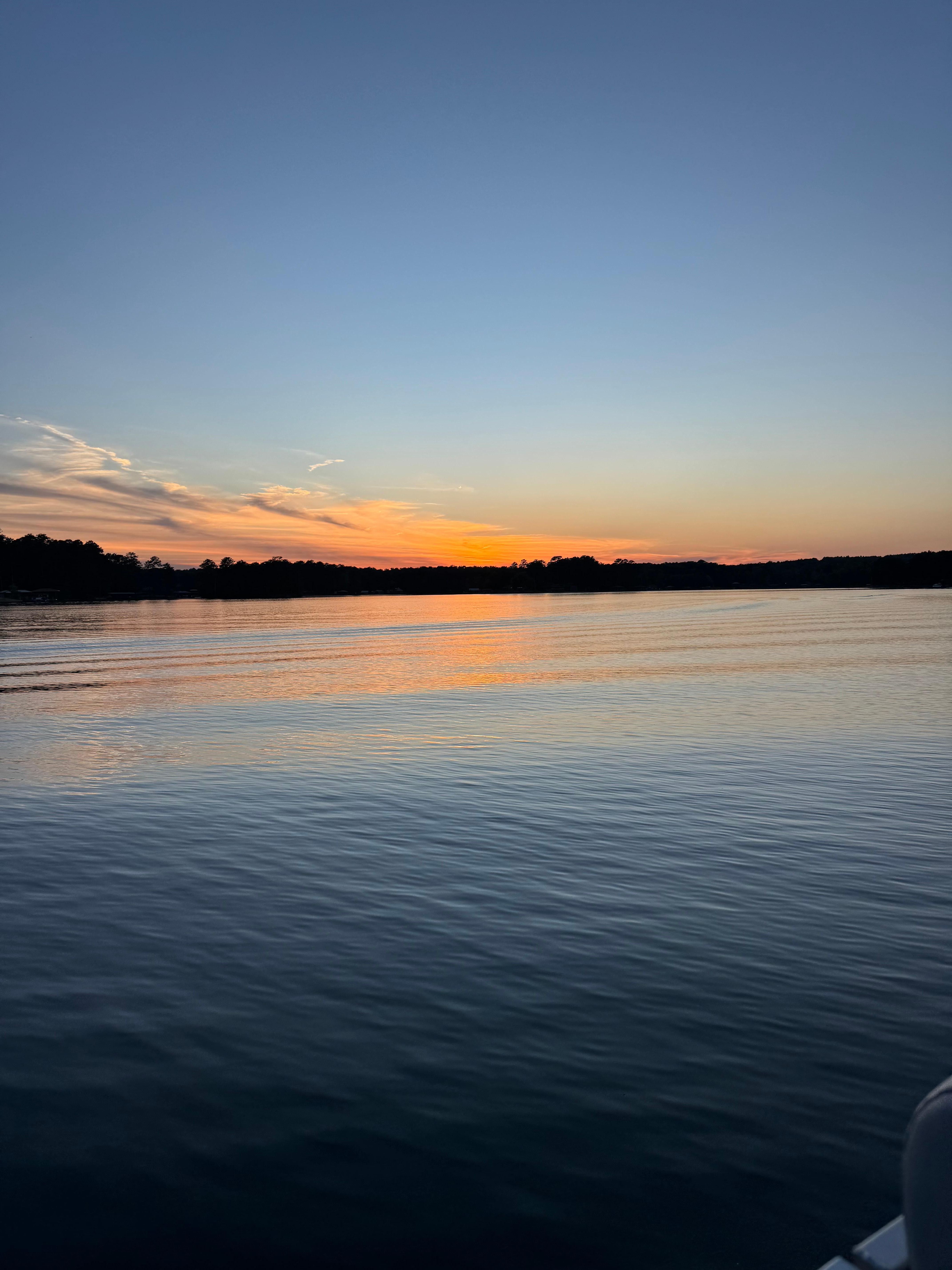 Sunset from an evening boat ride that was less visible but the sky colors were amazing 