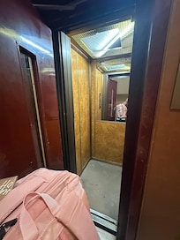 Elevator is small. 2 people or 1 person with large amount of luggage