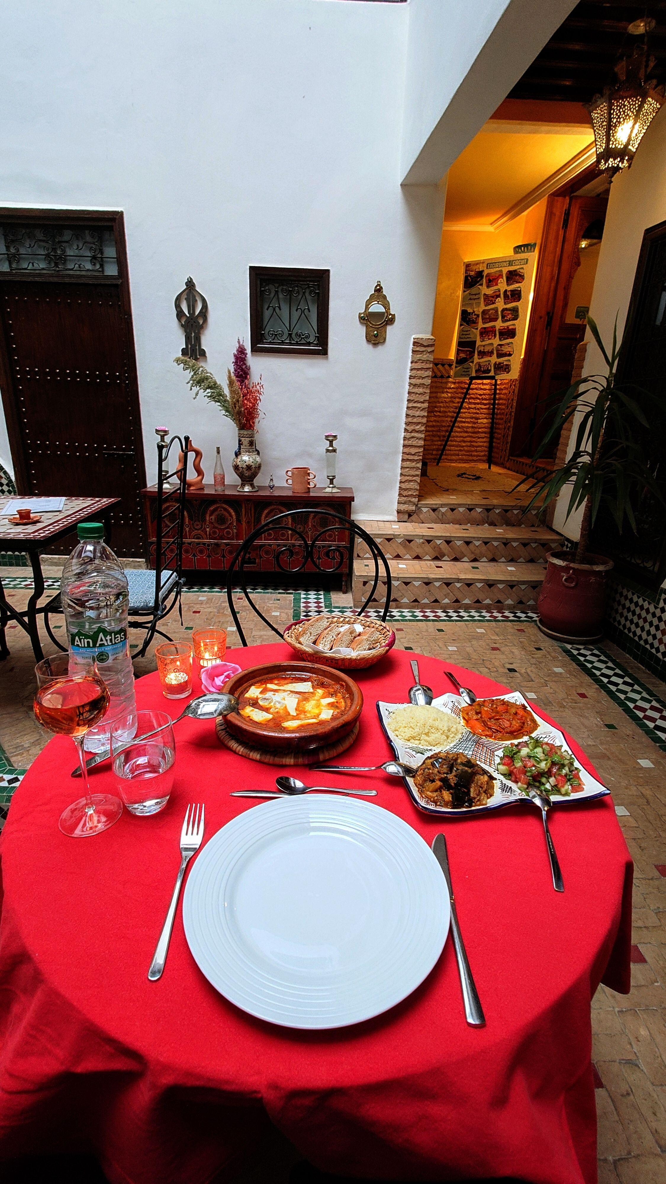 Tajin with meatballs and cheese, aubergine zalouk, a tomato salad, good bread, and Moroccan wine.