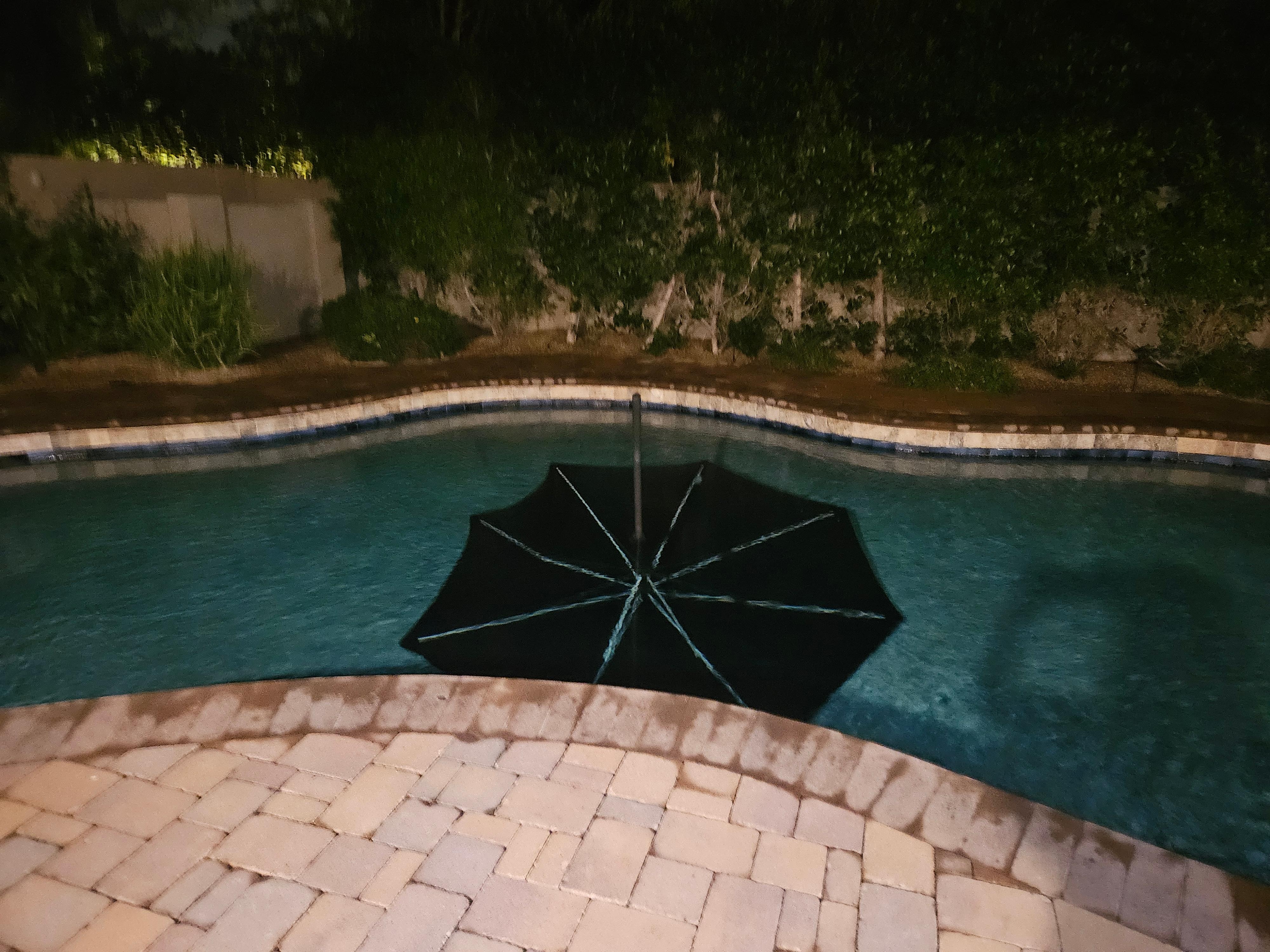 Umbrella at the bottom of the pool. 