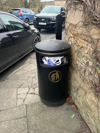 bin in front of hotel