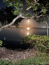 Full moon rising over bay