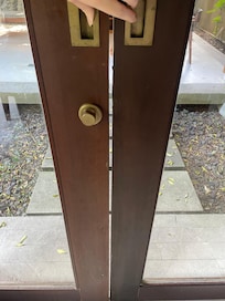 The door not closing completely (and there’s space between the door and the wall as well)