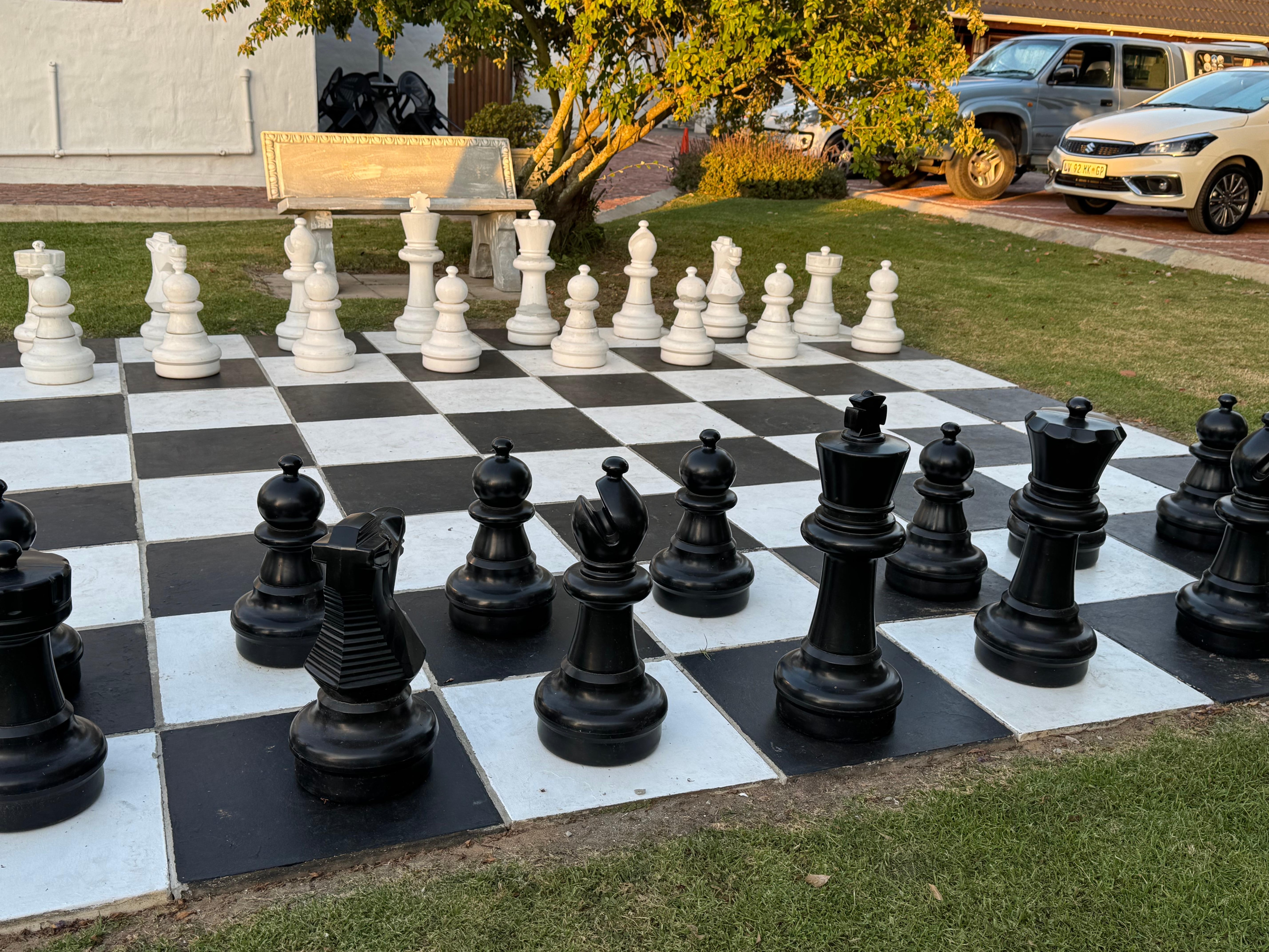 Giant chess set near pool