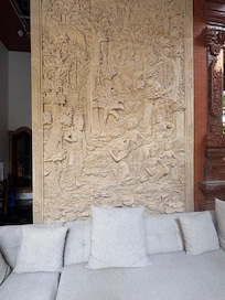 Hand-carved stone wall in lounge area