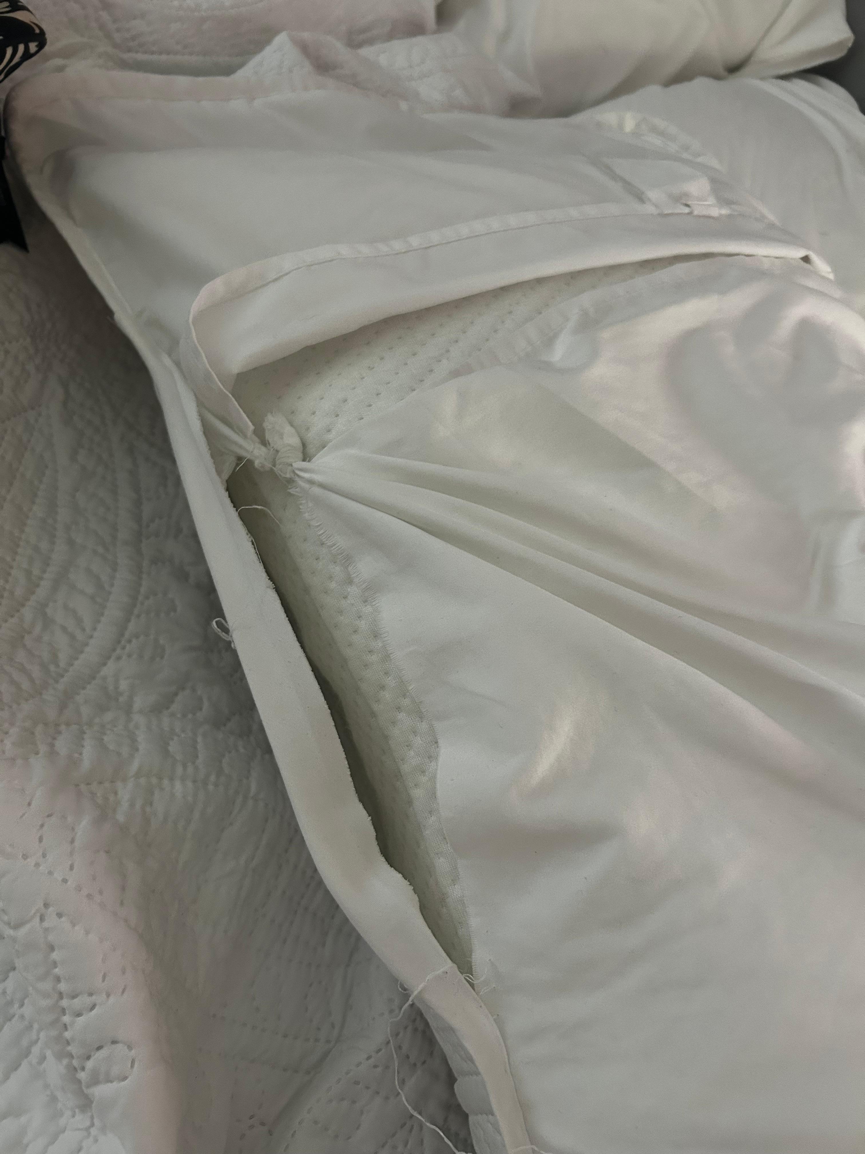 Tattered, tied together pillow sham