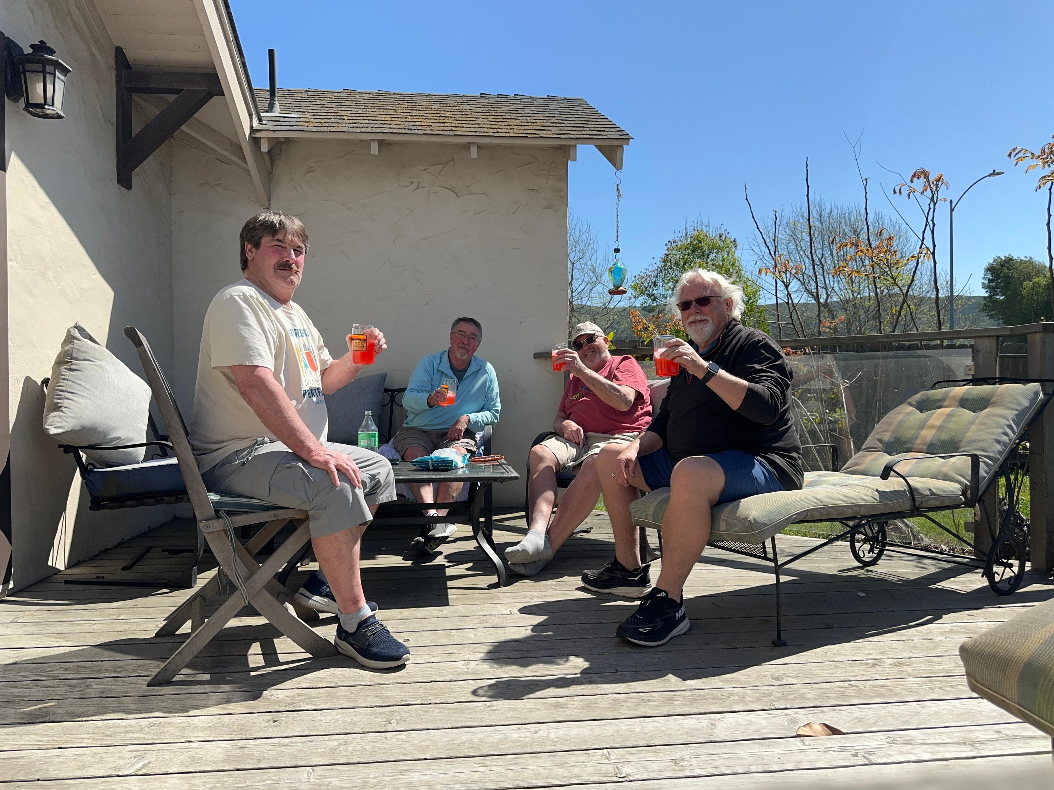Sitting on the deck having a cocktail after golf