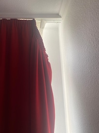 Curtains coming for the rails in the bedroom room