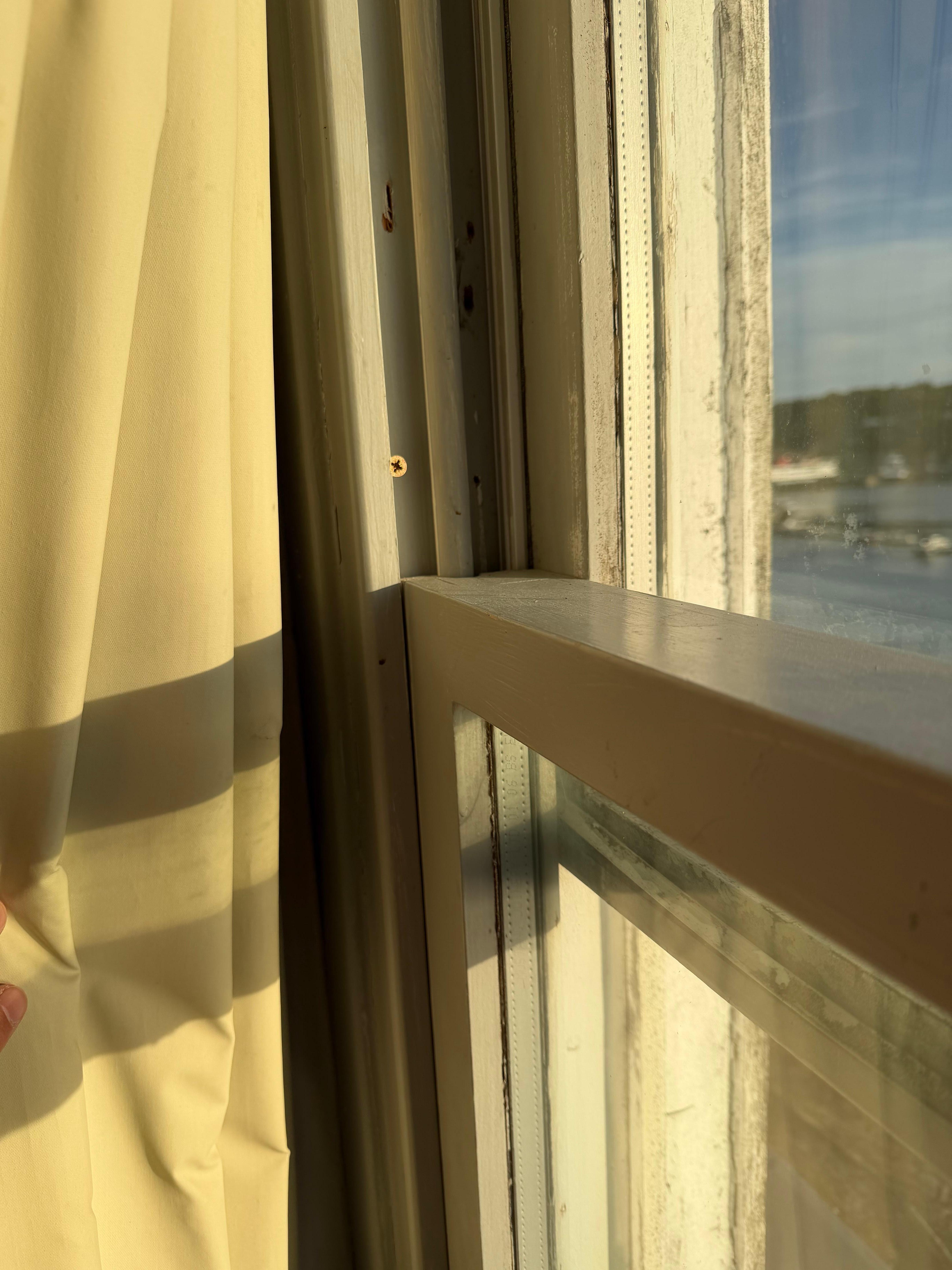 Window frame had screws preventing you from opening window very wide i.e. in case of emergency. 
