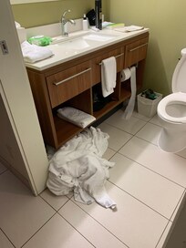 Pile of dirty towels that no one picked up,