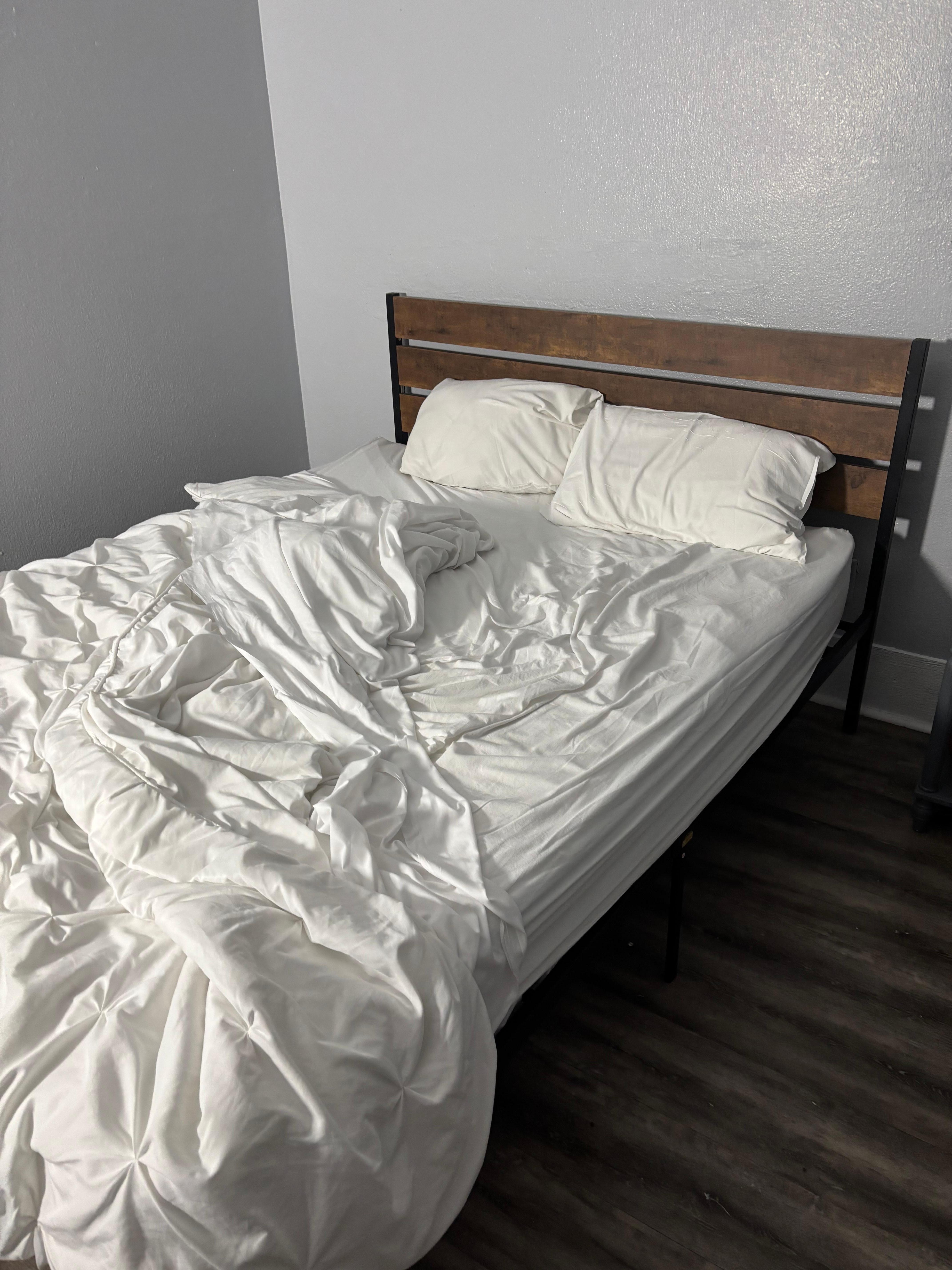 The toddler bed sitting 6 inches below the other