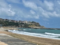 Beach across the usually not busy street. Traffic picks up at the weekend though