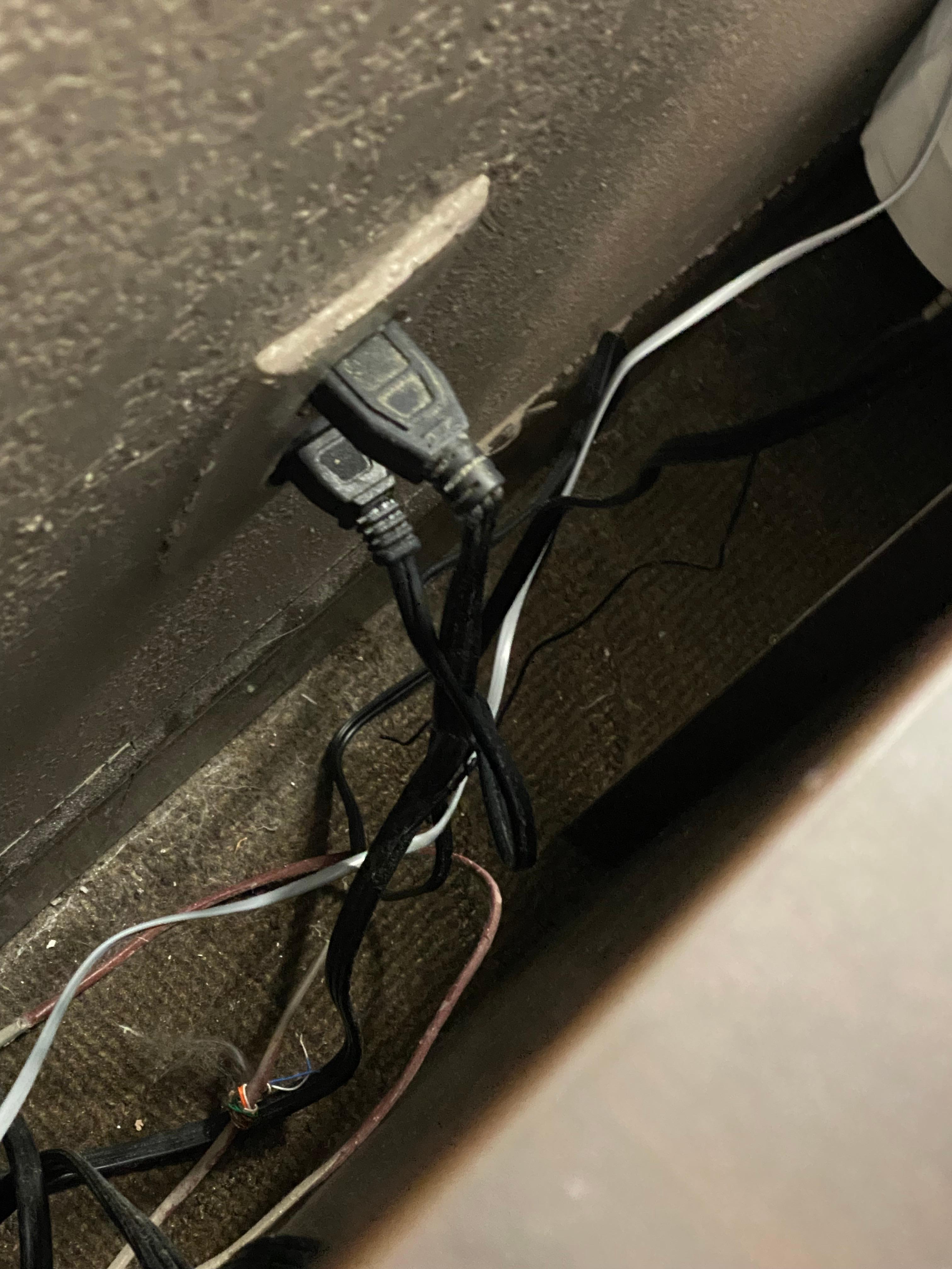 Behind nightstand 