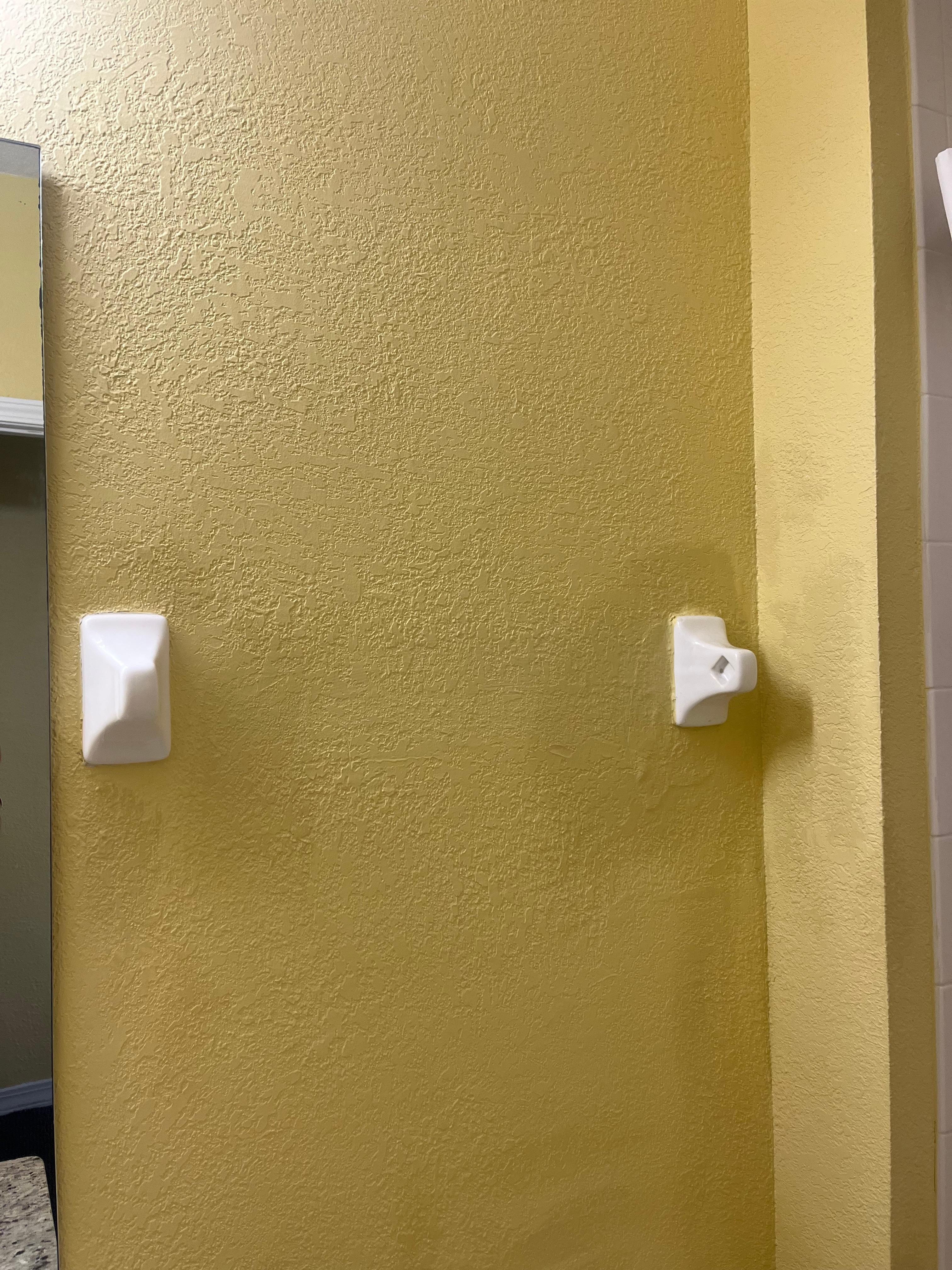 The towel bar is missing so there is no place to hang a towel. 