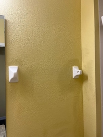 The towel bar is missing so there is no place to hang a towel.