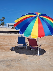 Nice beach shade and chairs provided by the owner