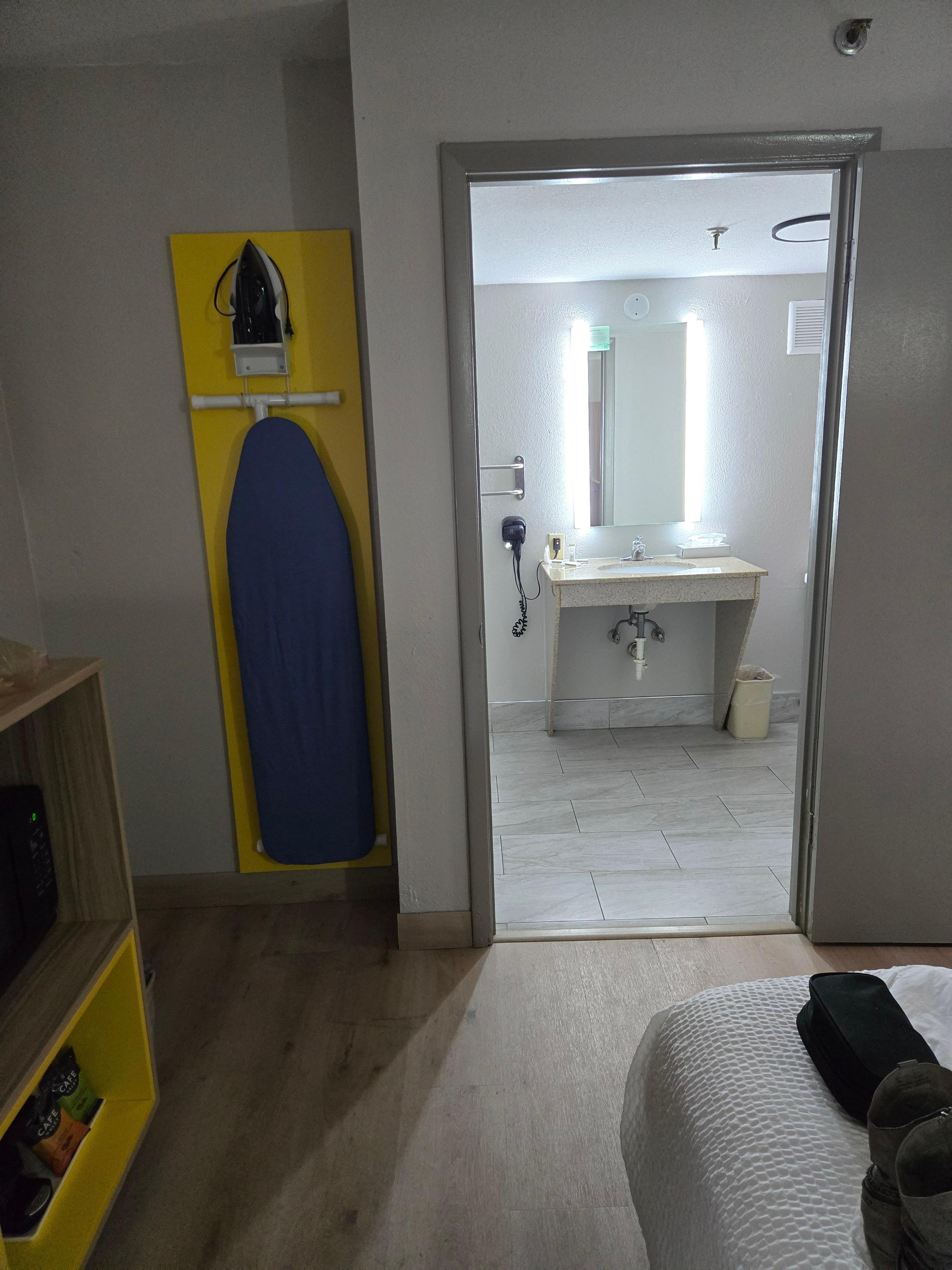 Ironing board, moved to use to hang clothes