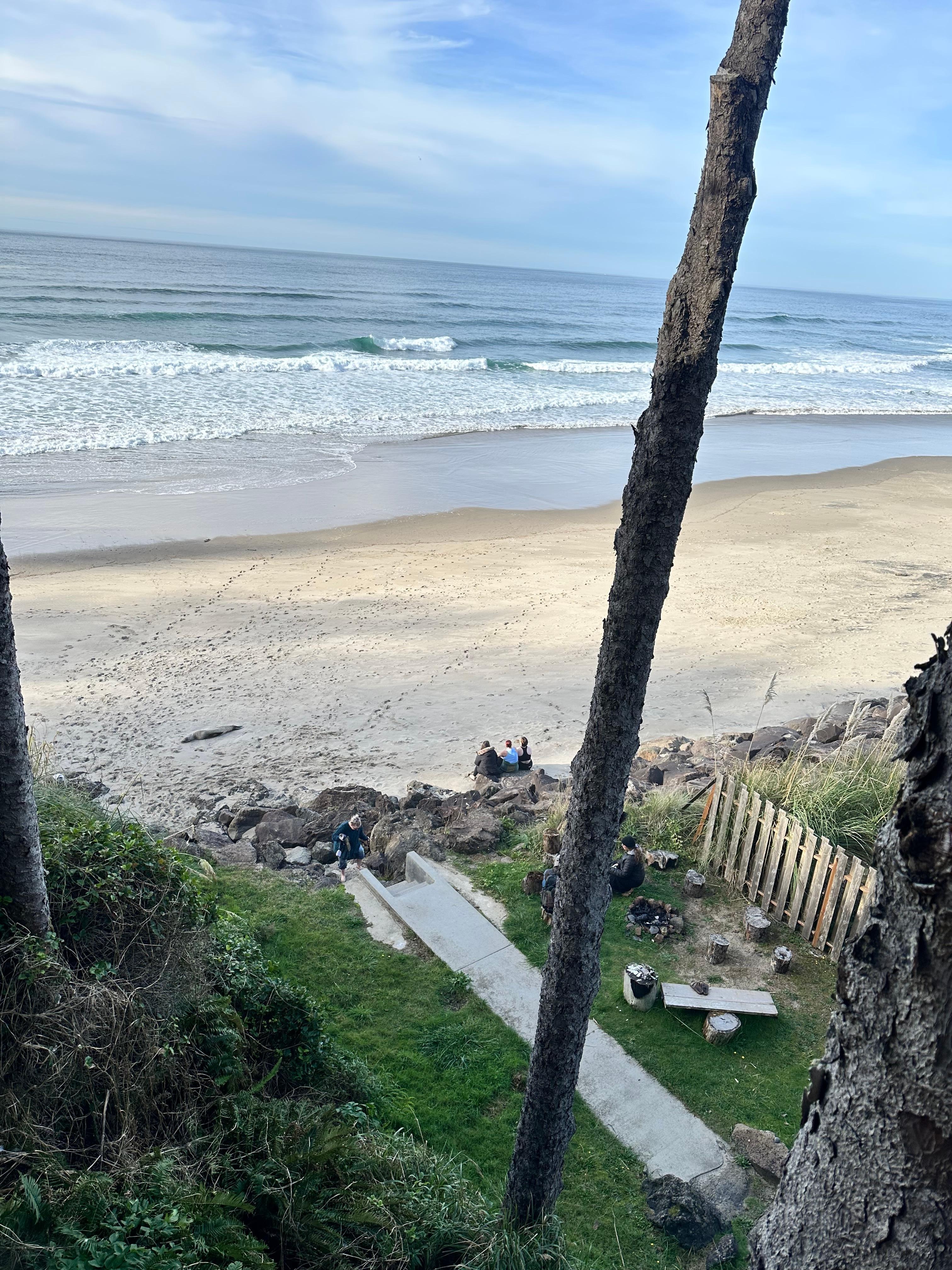View of the fire pit & beach access from the main floor balcony
