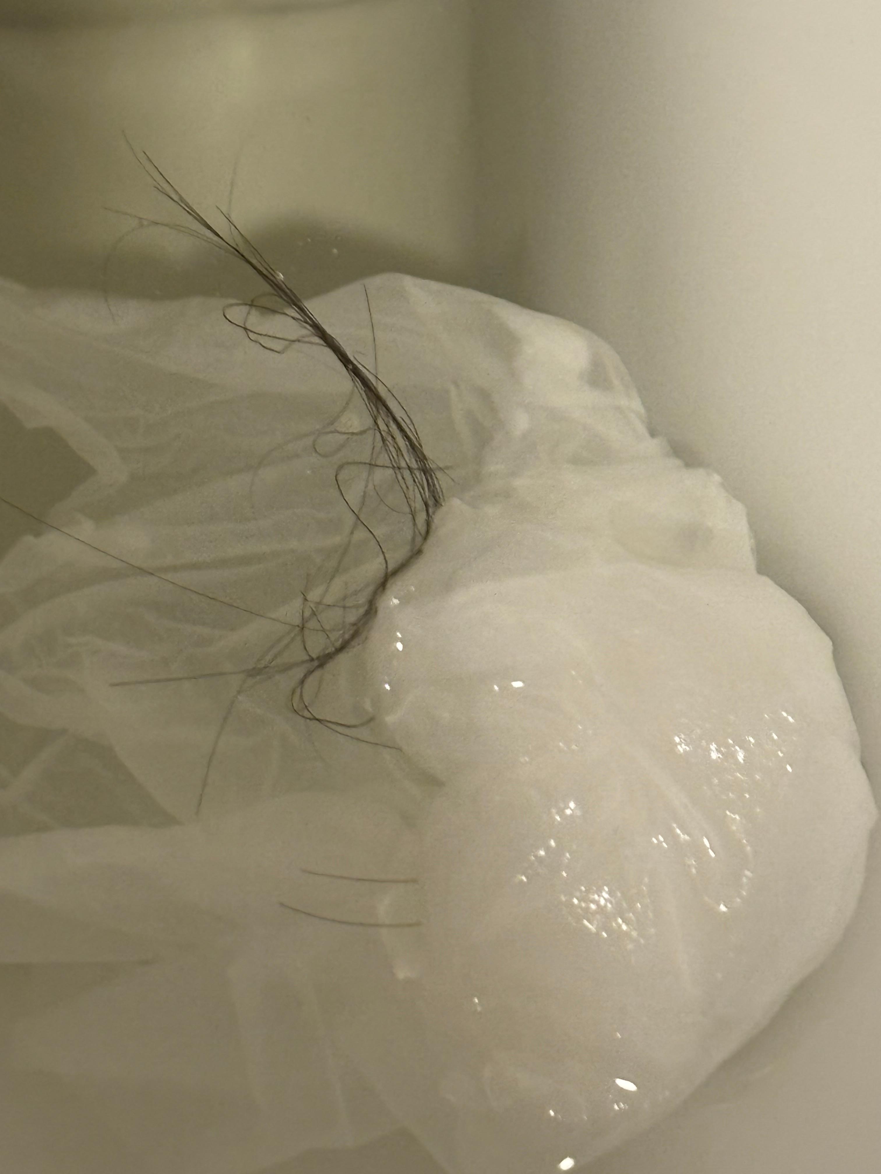 Black Hair in bathtub - I have no hair and my girlfriend has white hair 