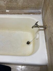 Peeling paint and dirty tub