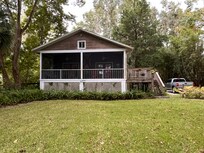 View of the house with huge screen porch across the back