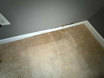 Rotten wood behind the trim, and you can see where our suitcase was sitting on the carpet. It was wet when we packed at the end of the week. The carpet is wet.