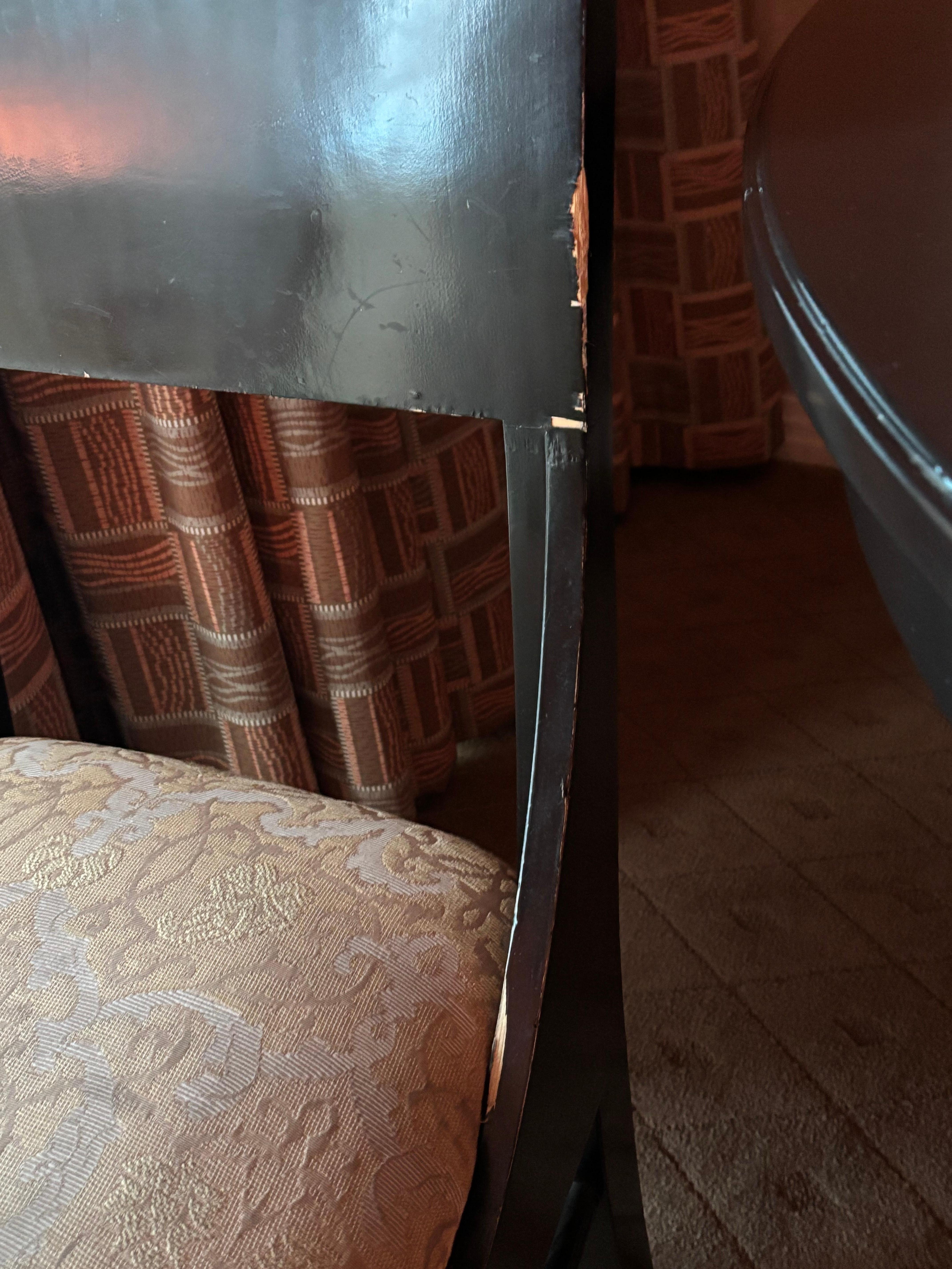 Both dining chairs were chipped away significantly 
