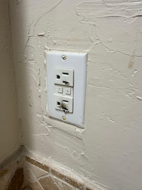 This is the electrical outlet next to one of the bathroom sinks - too frightening to use. Electrical outlet next to the other sink is not grounded.
