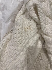 Dirty blanket on bed