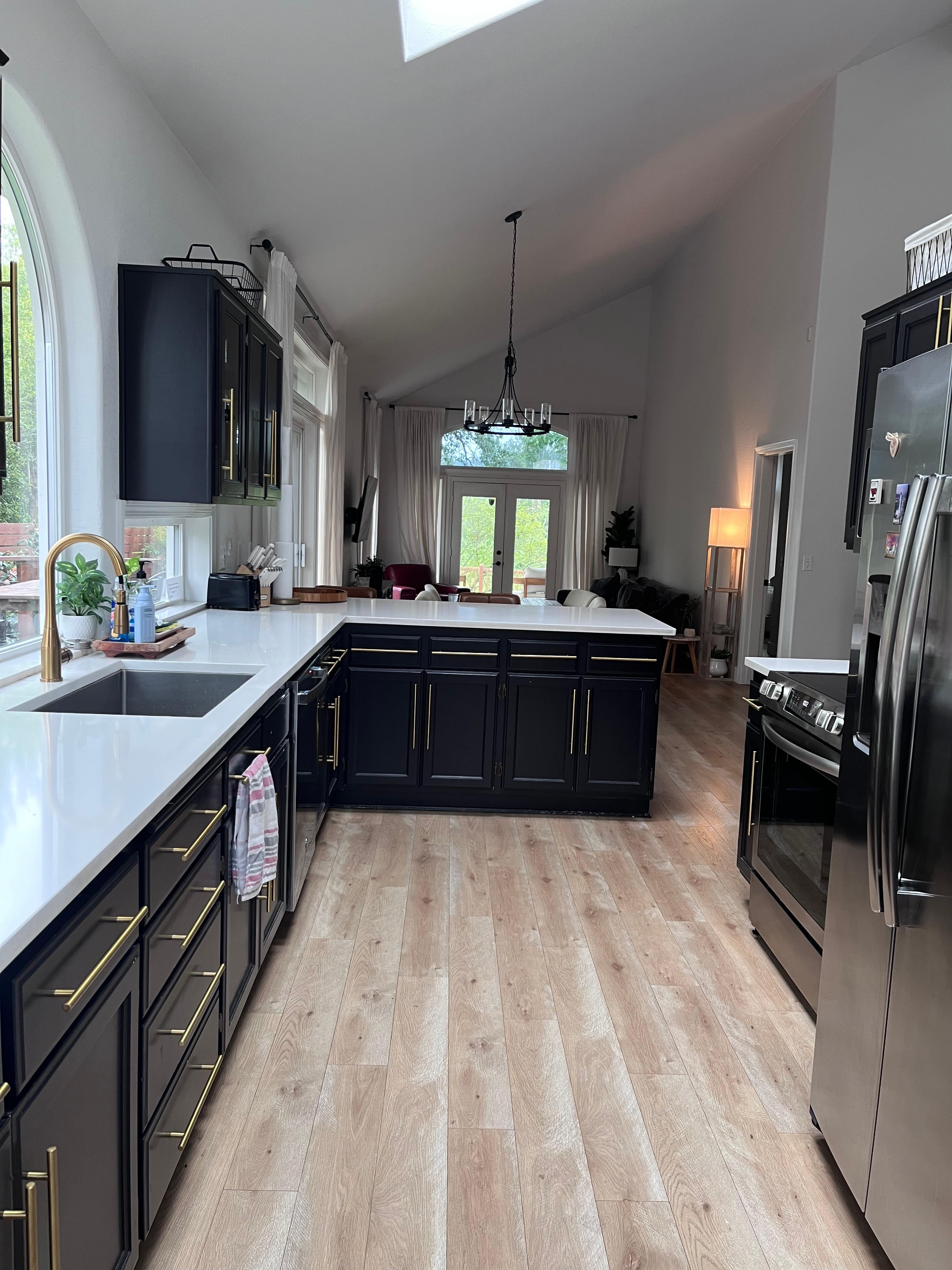 The kitchen, dining, and living room that exits to the back deck. 