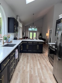The kitchen, dining, and living room that exits to the back deck.