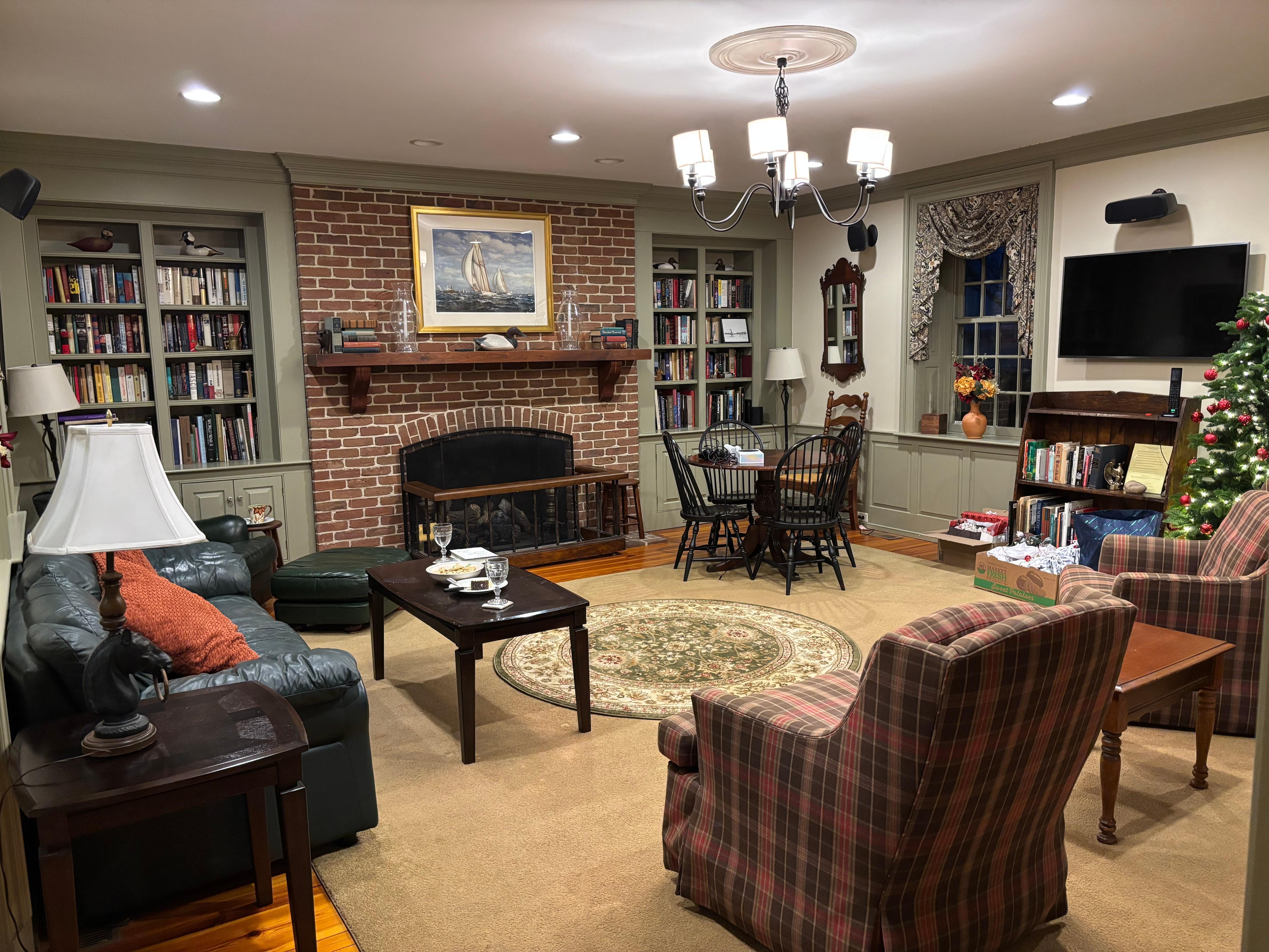 Library with gas fireplace and a good collection of books and games.