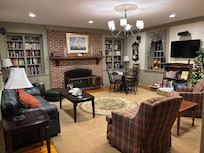 Library with gas fireplace and a good collection of books and games.