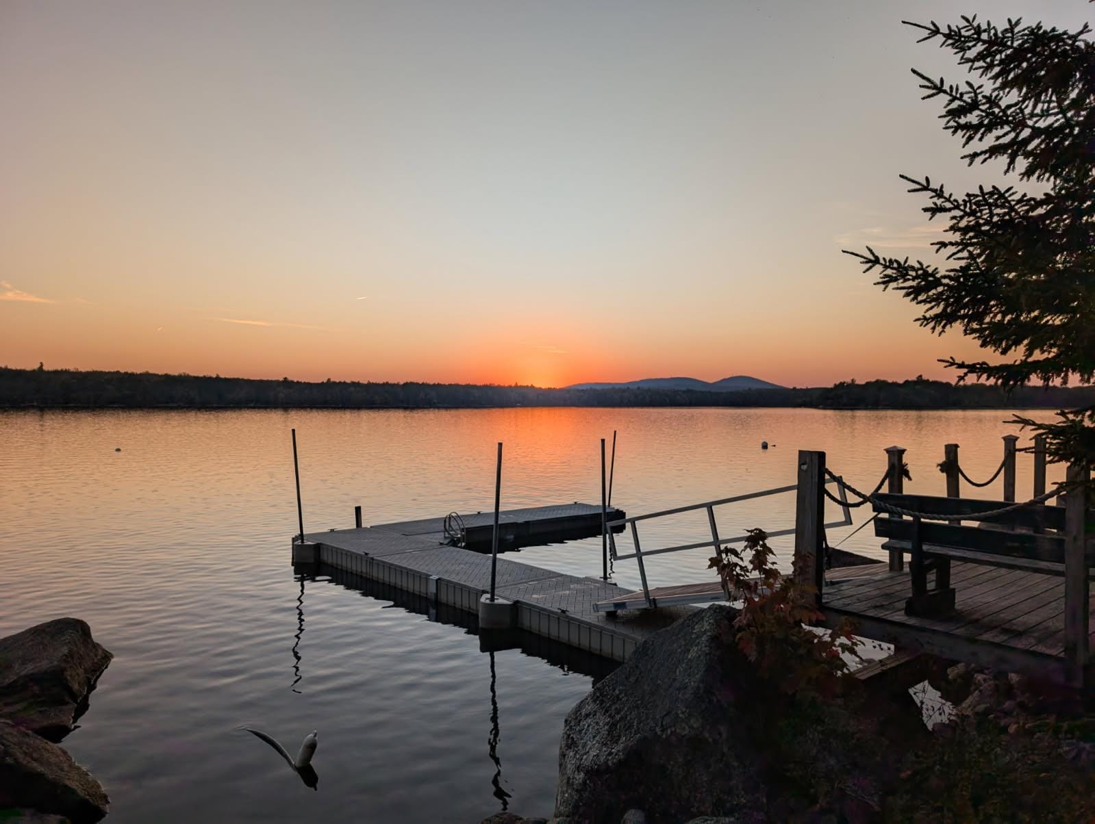Lakeshore private deck and dock at sunset
