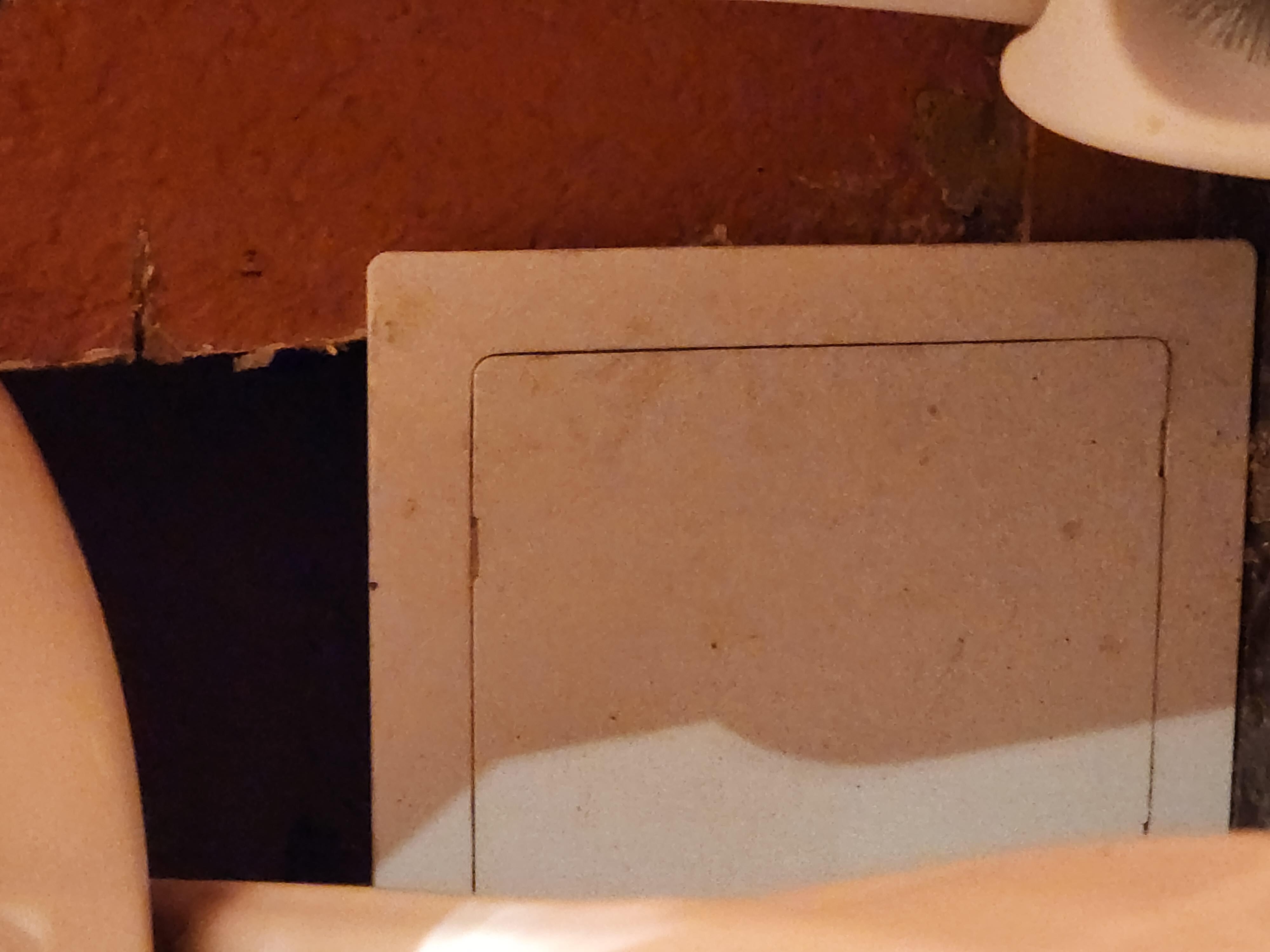 Whole in wall behind toilet